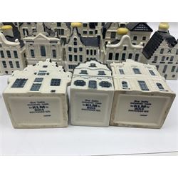 Twenty seven KLM Bols Blue Delft's decanters in the form of Dutch houses, some with contents