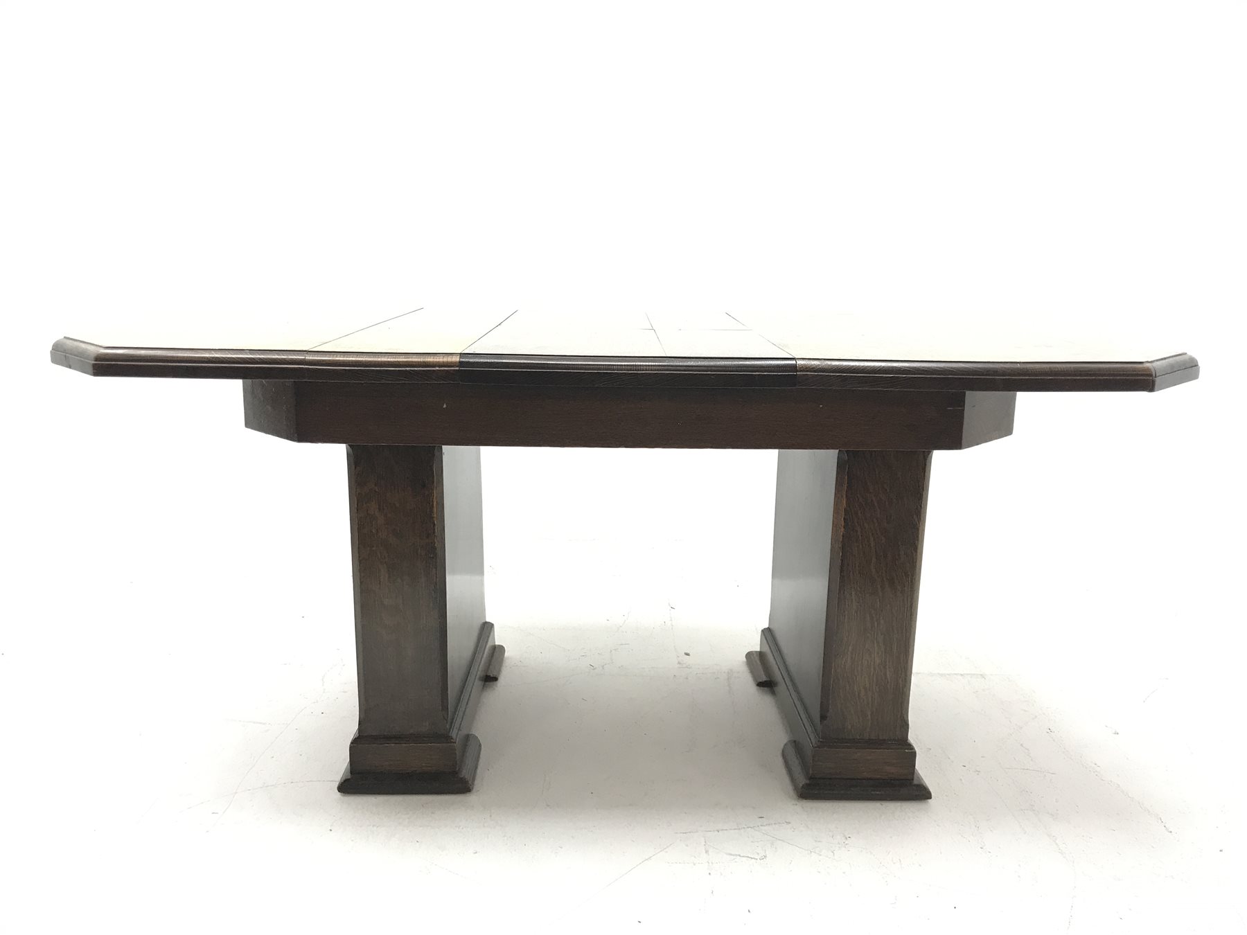 'The Celerity Patent' - Early 20th century oak extending dining table, canted rectangular moulded top with foldout leaf, on two rectangular box supports, 91cm x 122cm - 167cm, H74cm