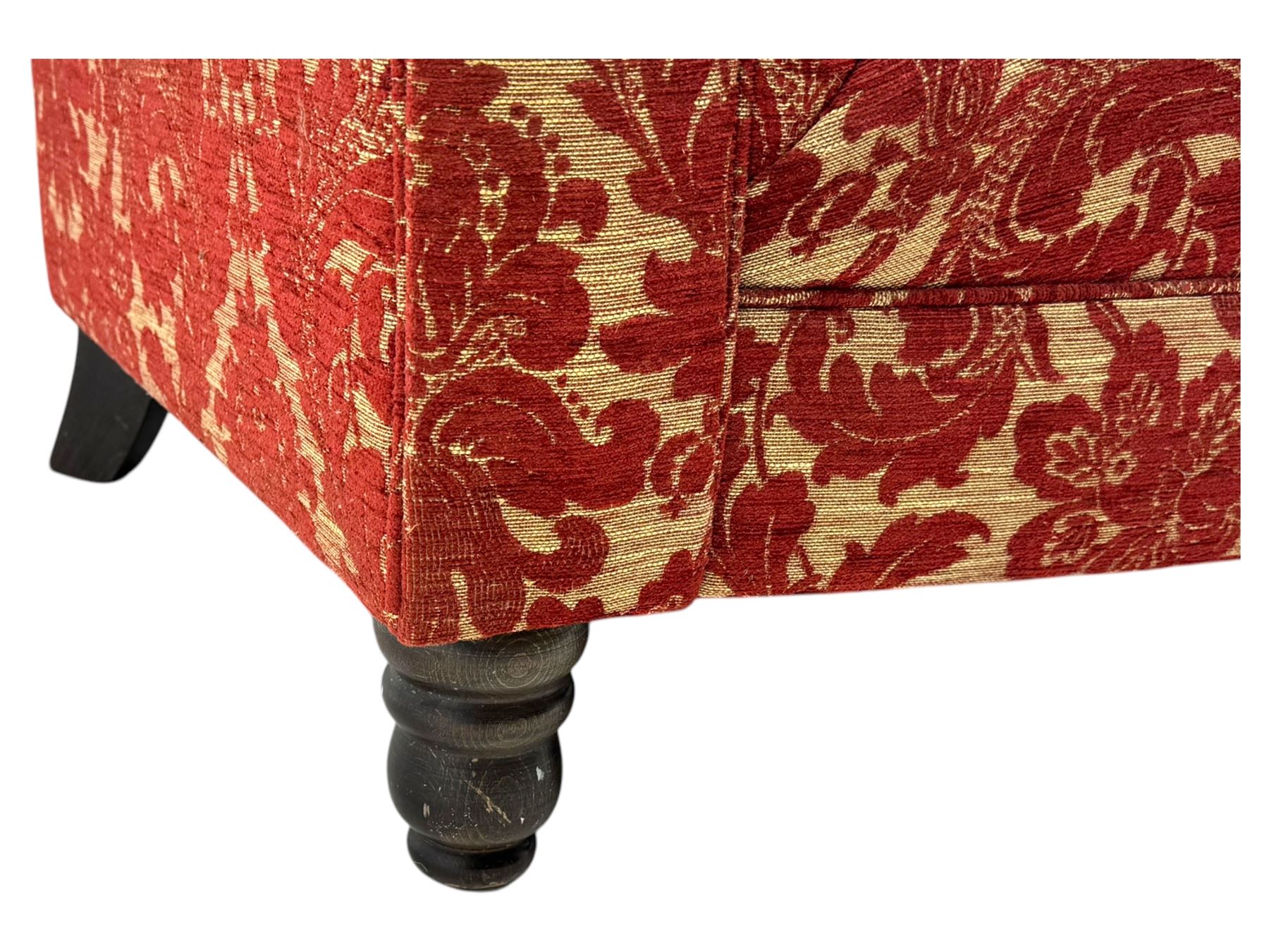 Late 20th century upholstered Chesterfield sofa, in red damask floral fabric, with deep buttoned back and arms, scrolled arms at equal height to back, on turned front supports