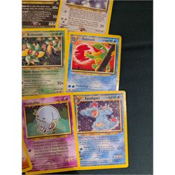 Collection of Pokemon TGC trading cards, including two WB First Movie Black Star promo cards Pikachu no. 4 and Dragonite no. 5, two Ancient Mew Black Star holo promo cards, Gym Challenge Giovanni's Persian 8/132 holo and a small collection WOTC, Neo Discovery and Neo Genesis cards, together with thirty four Bandai Carddass Pokemon cards, including prism Charizard no. 186 and Pokemon Topps cards including holo examples 