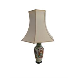 Oriental table lamp with figural decorat