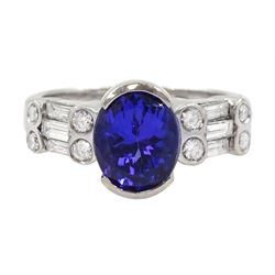 18ct white gold tanzanite and diamond ring, oval tanzanite, with baguette and round brilliant cut diamond surround, stamped 18k, tanzanite approx 2.80 carat, total diamond weight 0.60 carat