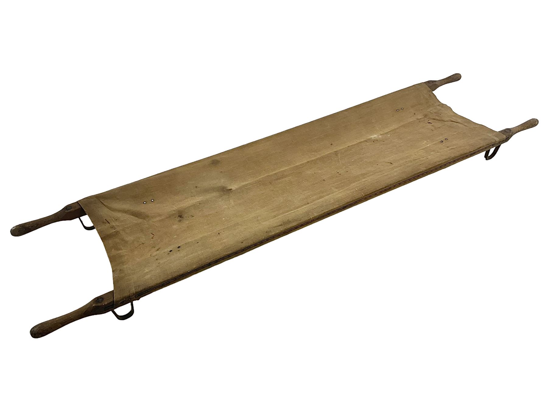 WW1 British casualty stretcher with iron mounted pitch pine sides and canvas base; stamped 'HL1917' and L7 with broad arrow in a triangle L236cm ( reputedly recovered from a barn at Bapaume on The Somme)