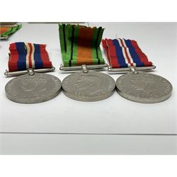 Twelve WW2 medals comprising four 1939-1945 war medals, four Defence medals, three 1939-1945 Stars and Africa Star; all with ribbons; some as groups in two issue boxes with slips