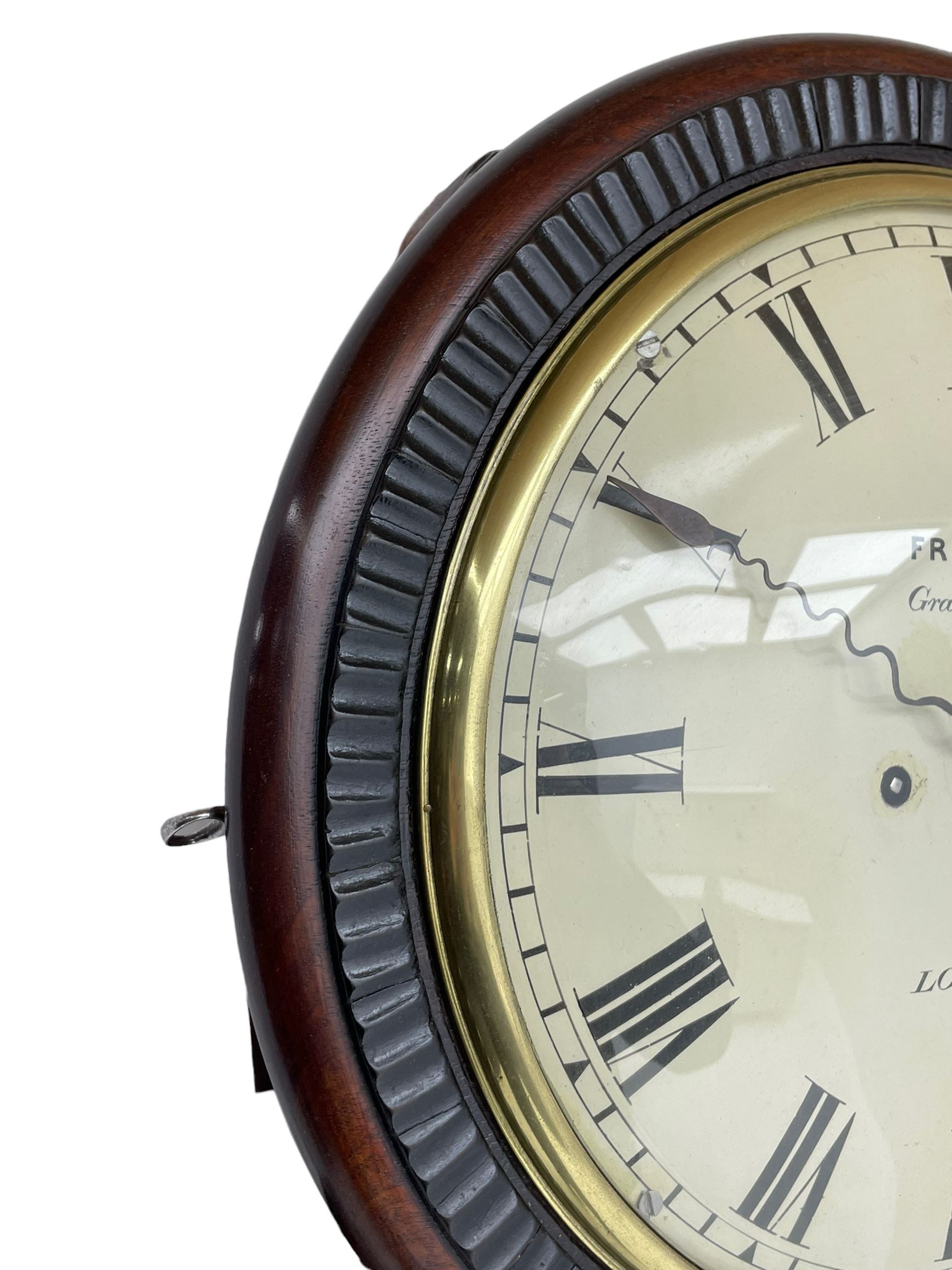 Frodsham of London - 8-day chain driven twin fusee wall clock in a mahogany case c1870, veneered case inlaid with brass stringing and motifs, shaped earpieces and chisel shaped base with pendulum adjustment door, 10” painted steel dial with Roman numerals, minute track and blued serpentine steel hands, dial inscribed Frodsham, Gracechurch Street, London, chain fusee, five-pillar, rack striking movement striking the hours on a cast bell. With pendulum.
H65 W34 D18
George Edward Frodsham, son of John Frodsham is recorded as working in Gracechurch Street, London 1869-79. Succeeded to Frodsham & Baker
