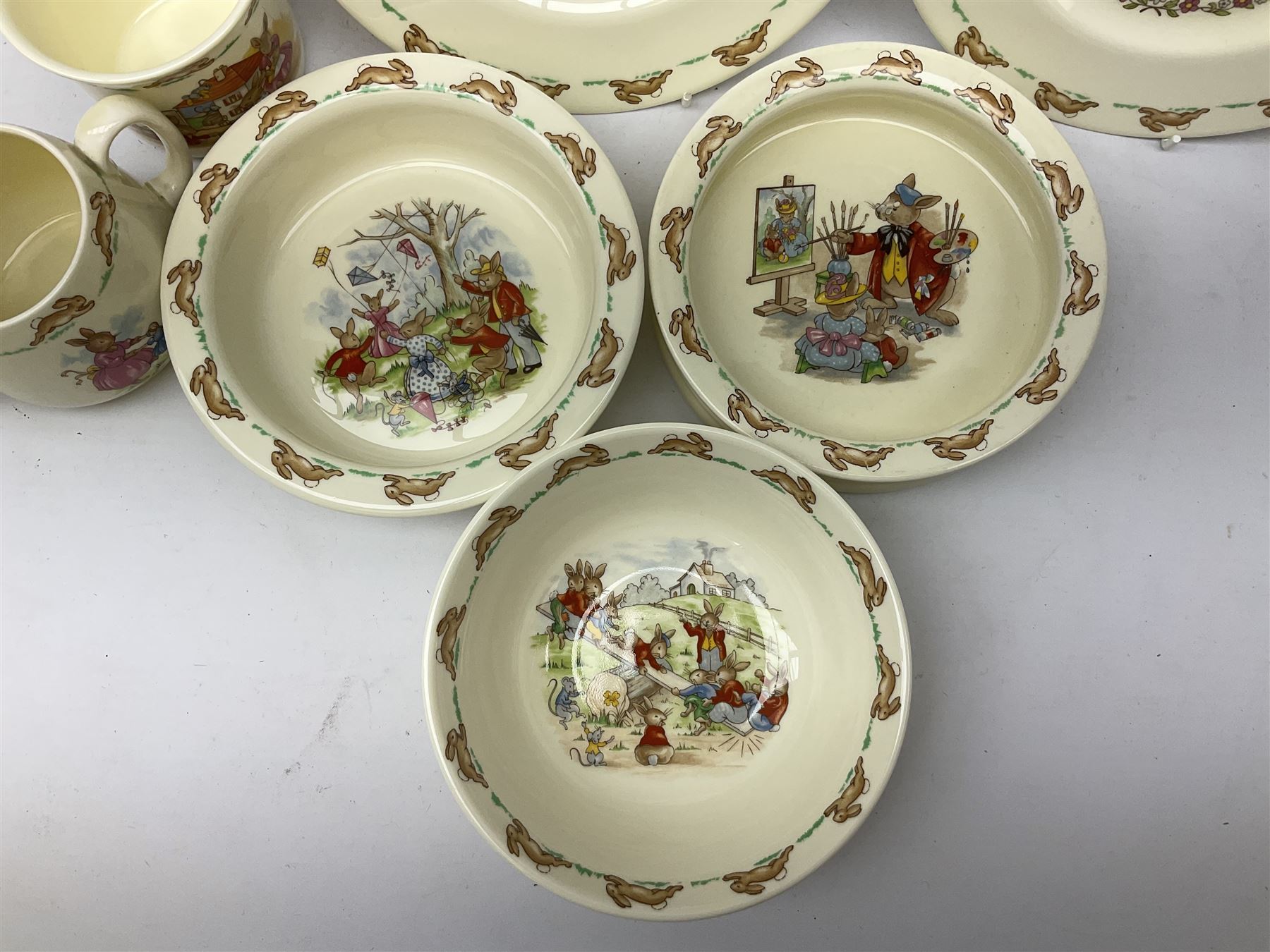Royal Doulton Bunnykins ceramics, comprising two baby bowls, twin handled cup, two plates, money box, cup, bowl and spoon (9)