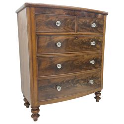 Victorian mahogany bow front chest, fitted with two short over three long graduating cock-beaded drawers, each with glass handles, raised on turned feet