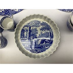 Spode blue and white Italian pattern dinner and tea wares, comprising five dinner plates, four side plates, seventeen side plates, four bowls, ten tea cups and twenty one saucers, five coffee cans and six saucers, and a flan dish, with blue and black printed marks beneath 