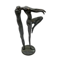 Bronze figure of a female nude with long flowing hair in stretched pose raised on circular base, H35cm