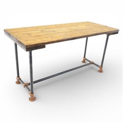 Industrial design oak topped table, the planked rectangular top upon metal pipe legs with ...