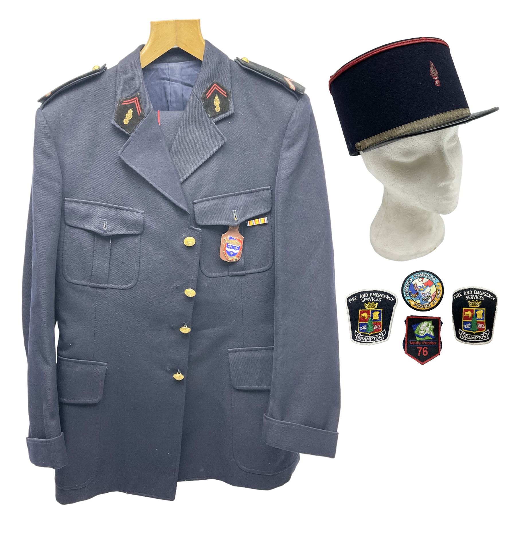 Mid 20th century French Ugeco Nantes first class dress navy blue uniform with ribbon bar with cap, and quantity of Sapeurs Pompiers patches, Sapeurs Pompiers de Caen belt buckle etc