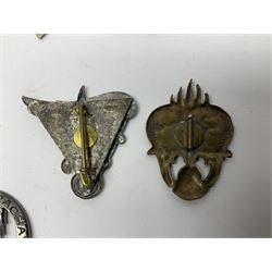 Eleven French Foreign Legion badges including various para, infantry and artillery (some copies)