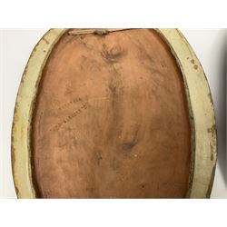 Pair of 19th century classical terracotta relief wall plaques depicting the goddess Hygeia and another goddess, seated holding an ewer, each of oval form, indistinctly signed, each stamped Ferreira verso, H42cm, W30cm