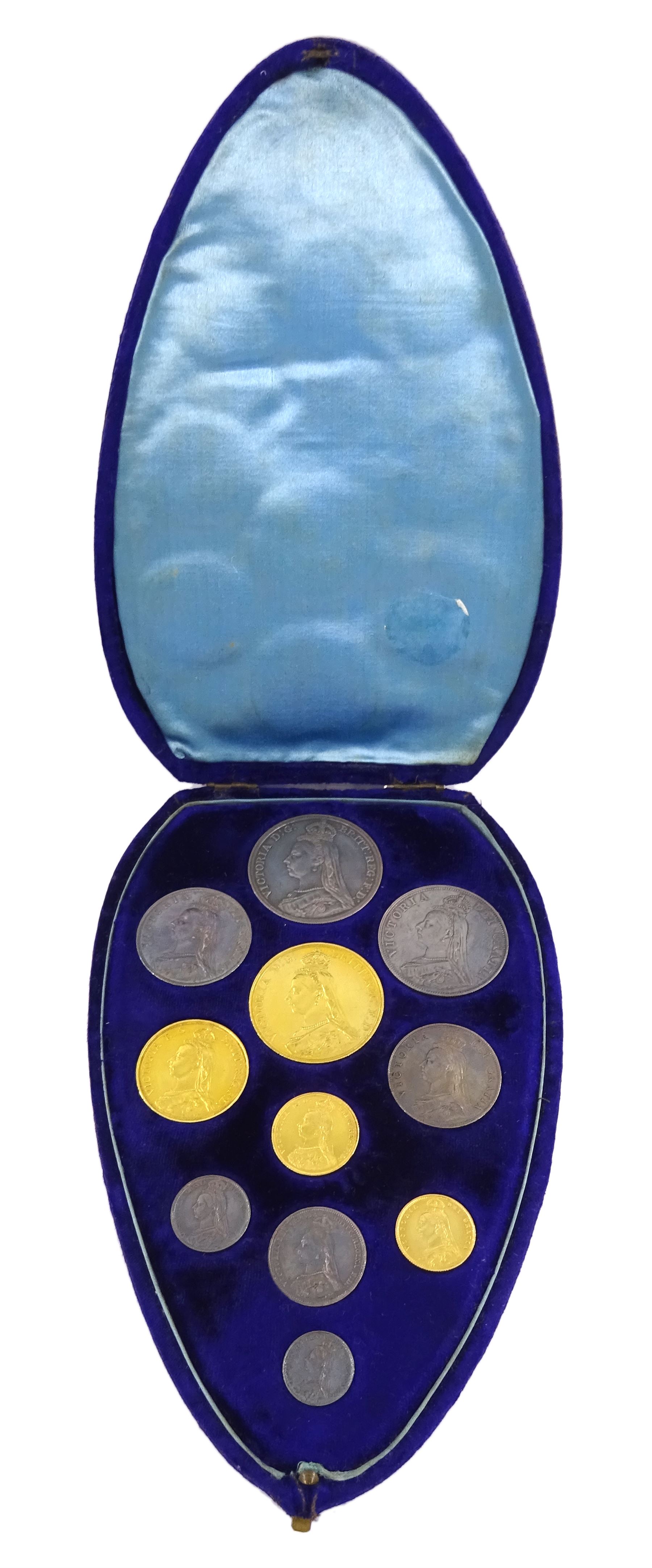 Queen Victoria 1887 specimen coin set, comprising gold half sovereign, sovereign, two pounds and five pounds, silver threepence, sixpence, shilling, florin, halfcrown, double florin and crown, housed in purple velvet case
