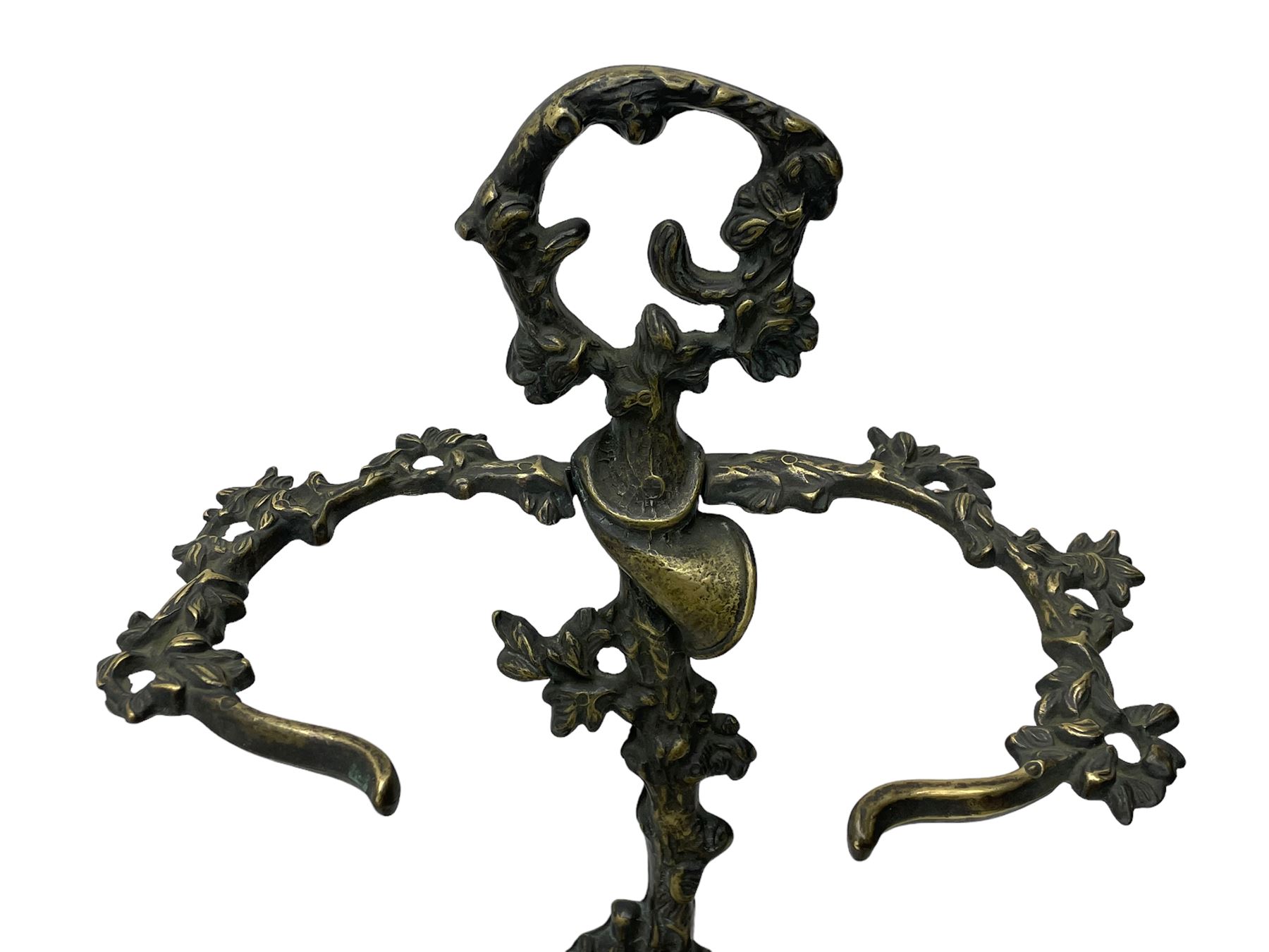 Pair of cast brass hallway umbrella or stick stands, in the form of a tree decorated with trailing flowering foliage branches, the stem with hunting horn over leaning shotgun, shaped naturalist tray base with hunting hound and out splayed foliate cast feet 