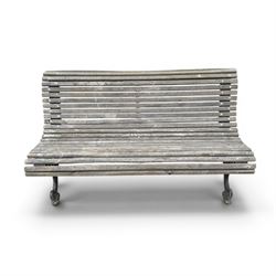 19th century cast iron and wood slatted garden bench, serpentine scroll form, ornate bow ends finished in green paint