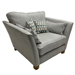 Oak Furnitureland - 'Gainsborough' lounge suite - three seat sofa, out-swept arms with loose cushions on turned oak feet, upholstered in 'Minerva Silver' fabric (W209cm D102cm H80cm); matching armchair or snuggler settee (W125cm); and rectangular ottoman footstool