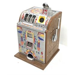 A one arm bandit fruit slot machine, the oak case with cast metal front and top with polychrome detail, with jackpot windows and single pull arm, patent no to front, H62cm. 