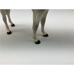 Beswick model of a huntswoman on grey horse model no 1730, and Beswick huntsman on brown horse model no 1501, both with printed mark beneath. 