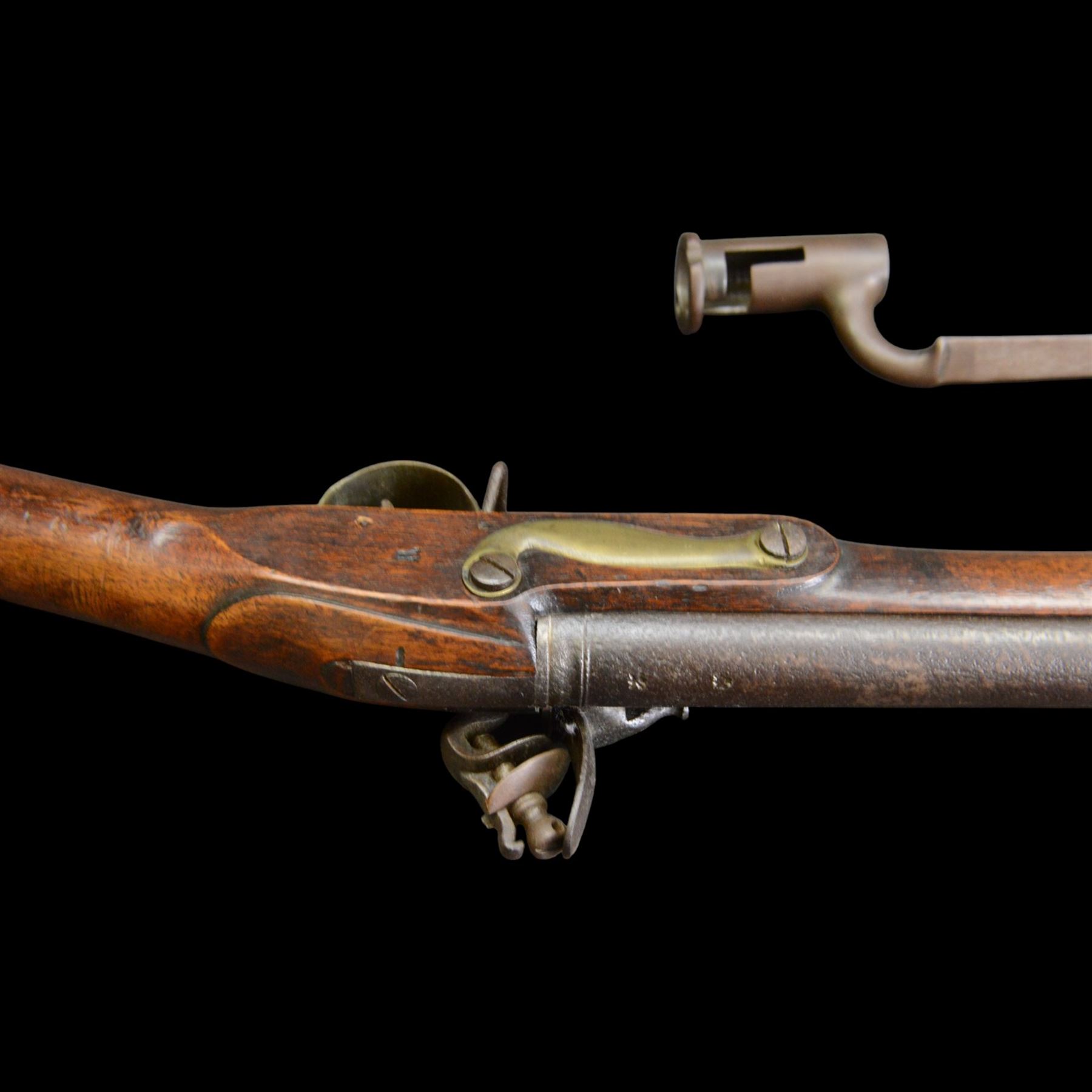 19th century 1793 Brown Bess flintlock musket, the 100cm barrel with ram rod under, full walnut stock with brass butt, carrying sling brackets, action marked Parsons and period triangular socket bayonet, L139cm
