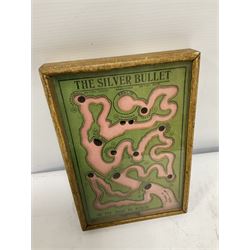 WWI 'The Silver Bullet or the Road to Berlin' ball bearing puzzle game, the stylised printed card map marked with various German towns and hazards on the allied advance to Berlin passing through towns and cities such as Hamburg and Dresden, manufactured by R. Farmer and Son circa 1916, with instructions label verso, in glazed frame