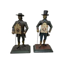 Two 29th century reproduction German traveling clockmaker figures and a small battery operated miniature lantern clock