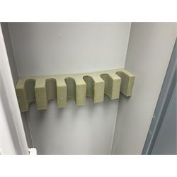 Two-tone grey steel wall-mounting gun cabinet by Sambell Engineering to accommodate six guns with fixed shelf over, gun space int. H132cm W36.5cm D23.5cm, the single double-locking door with two sets of keys, ext. H154cm W37cm D27cm