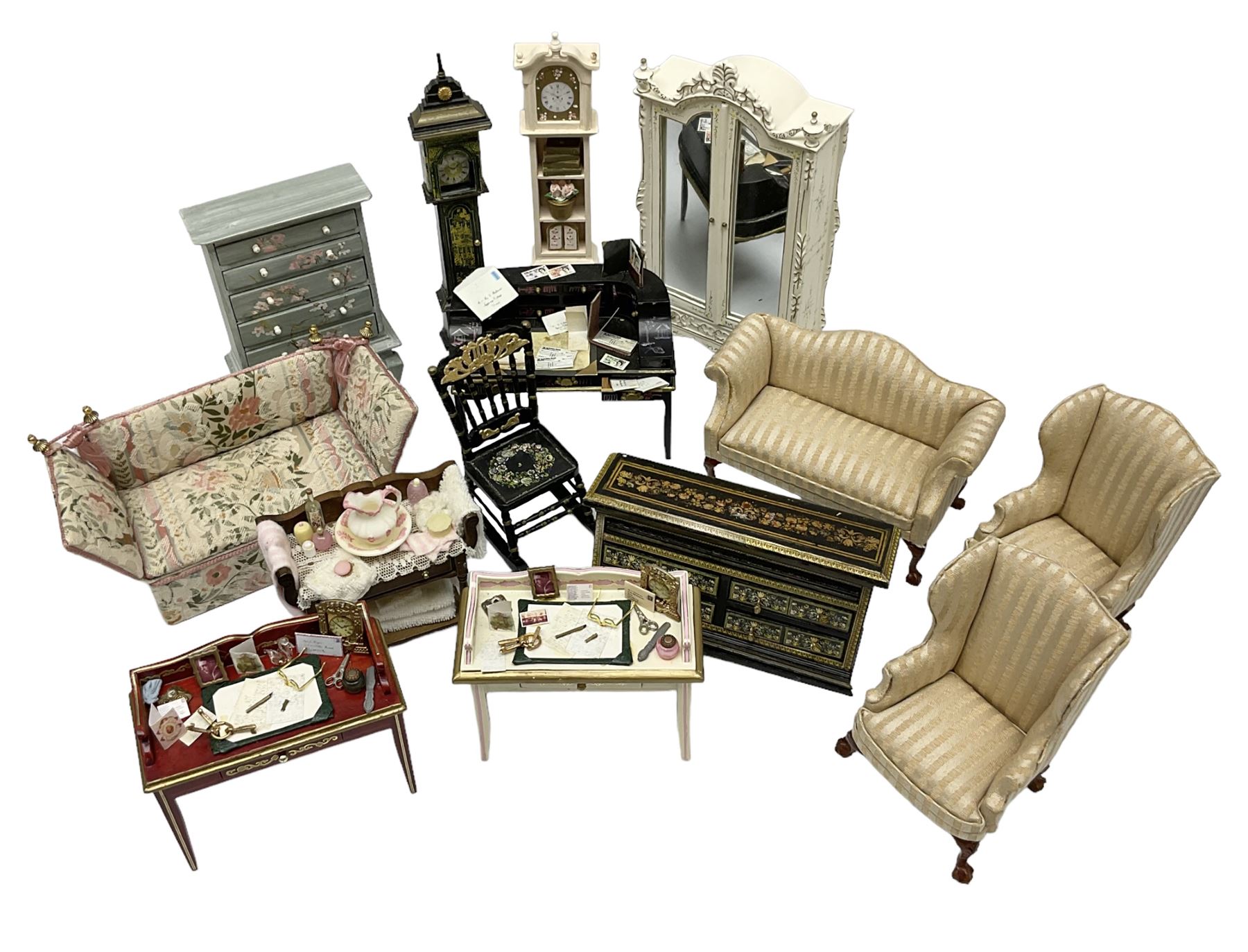 Collection of miniature dolls house furniture, to include five drawer chest painted with blossom, cream and gilt double door mirrored wardrobe, four piece lacquered style desk set, three piece suite, writing desk, wash stand, Knoll style sofa etc (14)