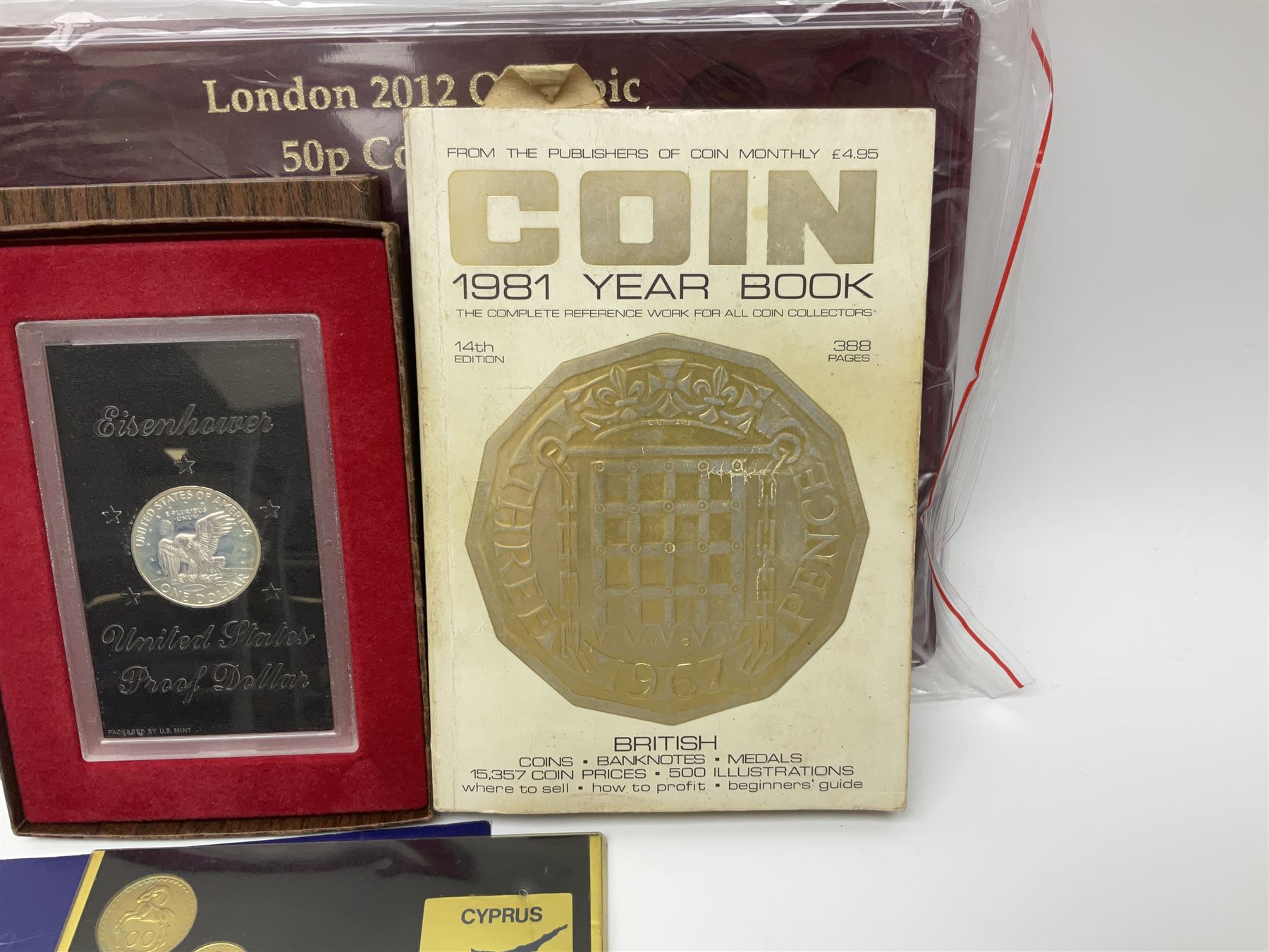 Coins, banknotes and miscellaneous items, including various denominations of Great British pre-decimal coinage, commemorative crowns, The Royal Bank of Scotland one pound notes, The Bank of England one pound notes, United States of America 1972 Eisenhower proof dollar coin in display case, empty unofficial display for a the 'London 2012 Olympic 50p Collection' etc
