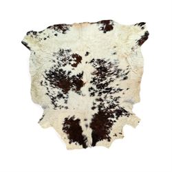 Skins/Hides: Large cow hide rug (Bos taurus), with dark brown and white dapple pattern, W78cm