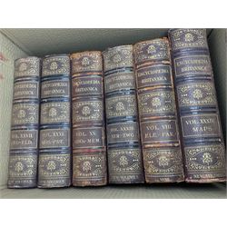 Thirty six volumes of Encyclopaedia Britannica with gold tooled red leather spines in various editions 