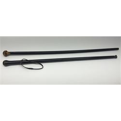 Two ebonised walking sticks, one with 'Leeds City Police' embossed top, tallest H92cm