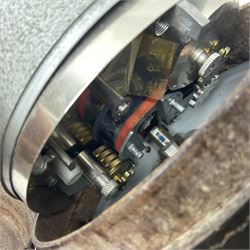 Metal cased drum shaped travelling clock with grey hammered finish, French clockwork movement and stitched leather outer case with shoulder strap; bears manuscript label 'Royal Armament Research and Development Establishment - serial no.09433' D13cm overall