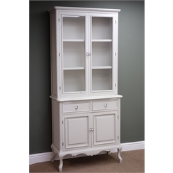  French style painted bookcase on cupboard, projecting cornice, two doors enclosing shelves above two drawers and two cupboard doors, cabriole legs, W88cm, H200cm, D40cm (MAO0503)  