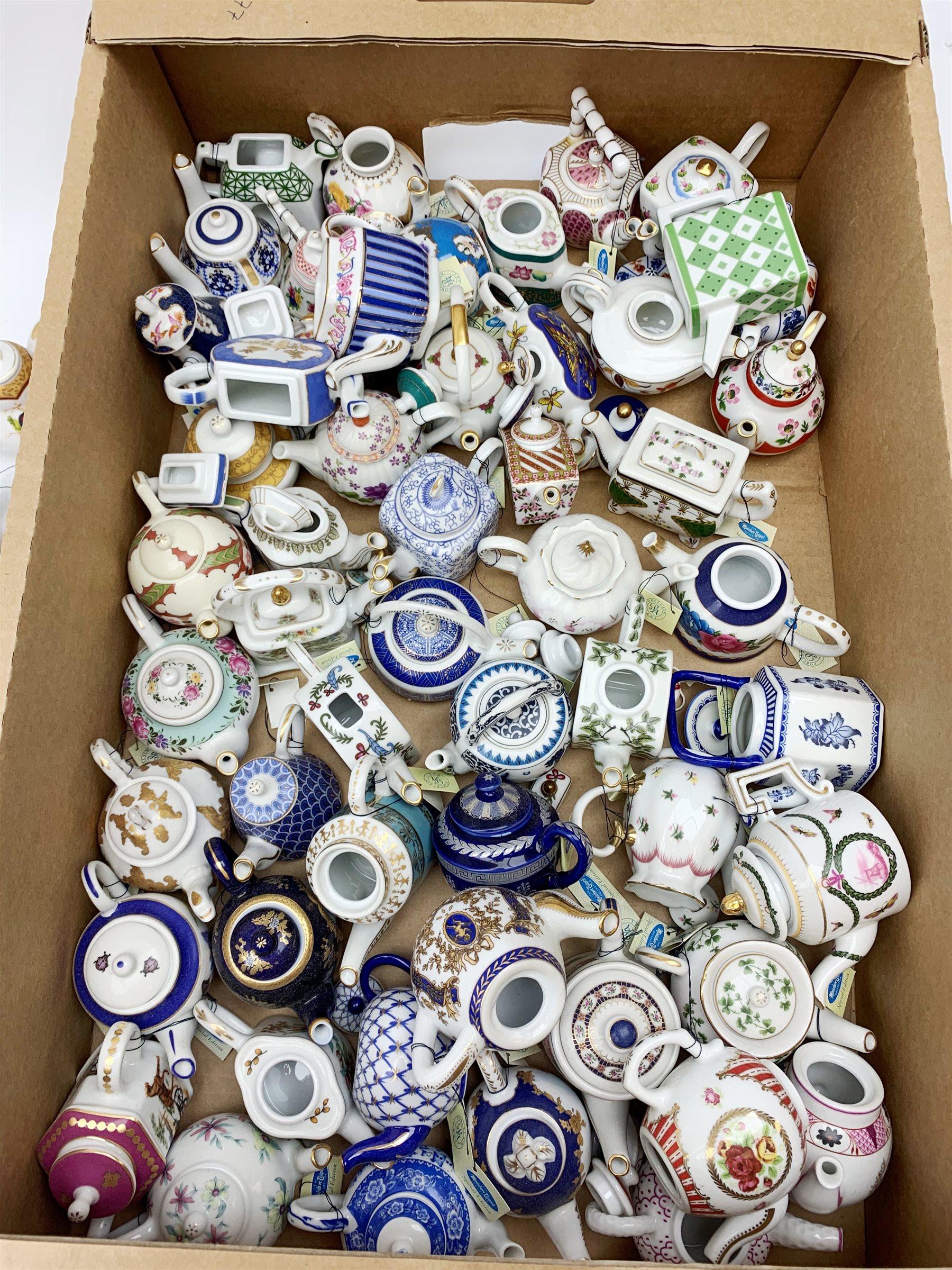 A large collection of miniature teapots, mostly by Porcelain Art. 