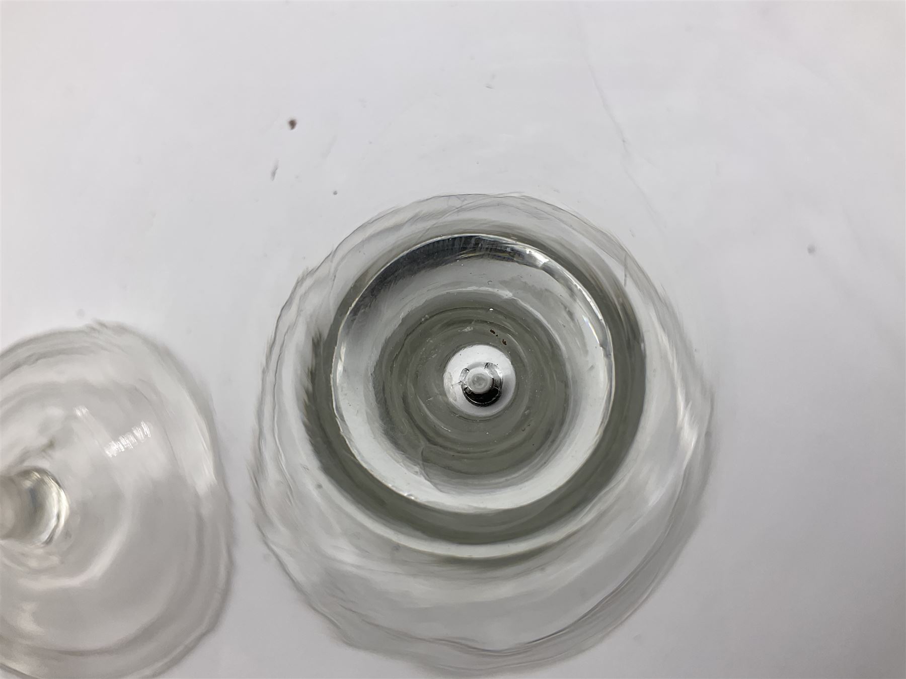 18th century wine glass, the trumpet shaped bowl upon tear drop stem and conical folded foot, H15.5cm, together with an 18th century cordial glass, the round funnel bowl on plain knopped stem and folded conical foot