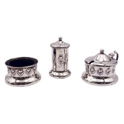 Art Nouveau three piece silver cruet set, comprising mustard pot and cover with blue glass liner, open salt with blue glass liner, and pepper, each repousse decorated with a band of flowers, hallmarked John Rose, Birmingham 1907, approximate silver weight 3.01 ozt (93.6 grams)