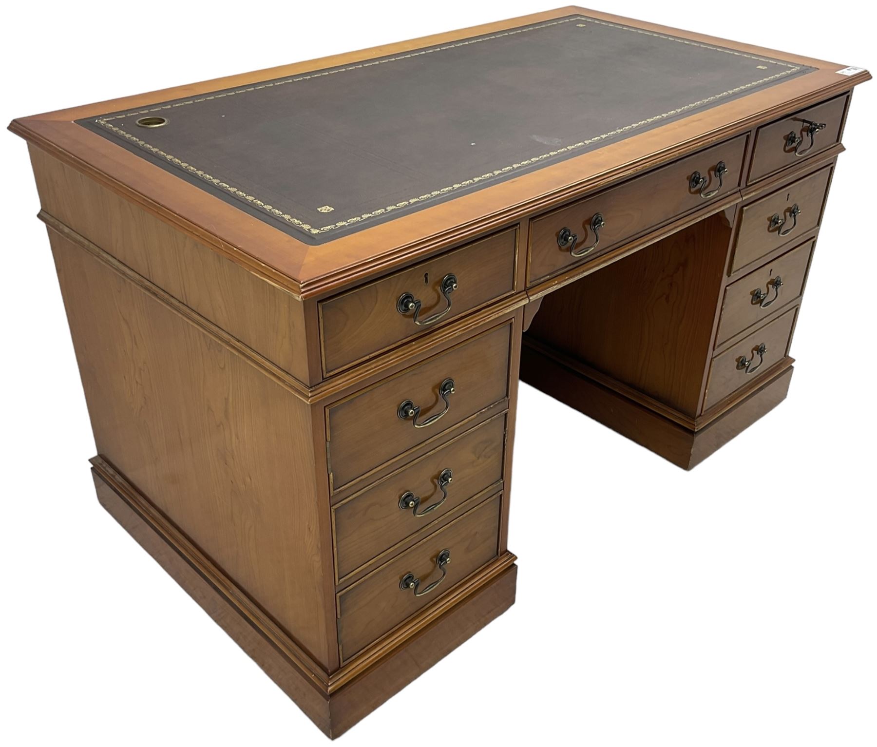 Cherrywood twin pedestal desk, rectangular leather inset top over central fall front with keyboard slide and two drawers, fitted with two drawers and cupboard, on bracket feet