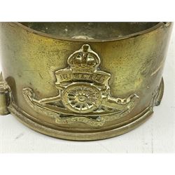 Trench Art - three WW2 brass shell case ashtrays, one mounted with Royal Artillery cap badge and button and one mounted with RA button; together with a pair of place name holders each formed from a Royal Artillery cap badge (5)