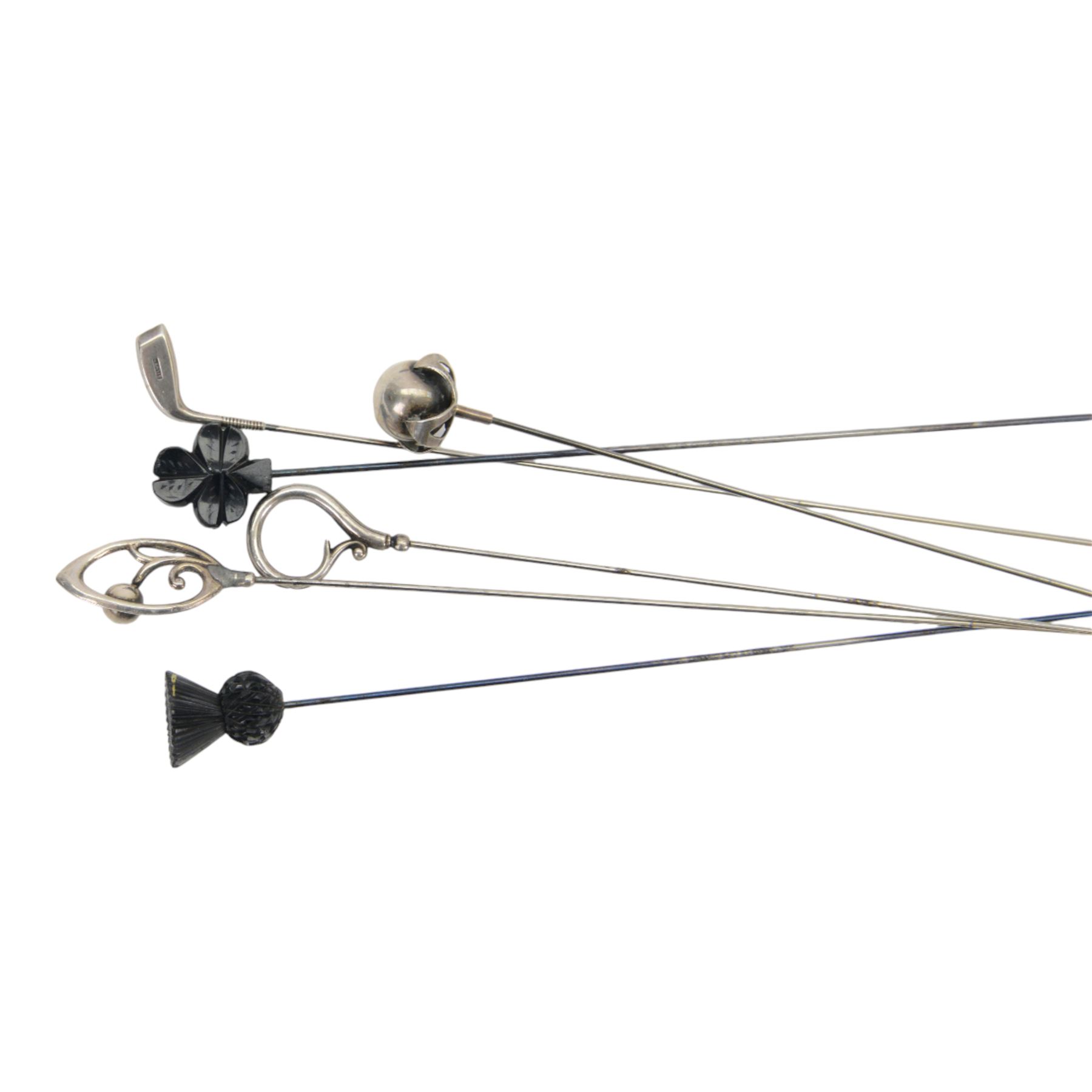 Collection of four silver hatpins including two Charles Horner examples, hallmarked, together with two other hatpins, all within a metal case