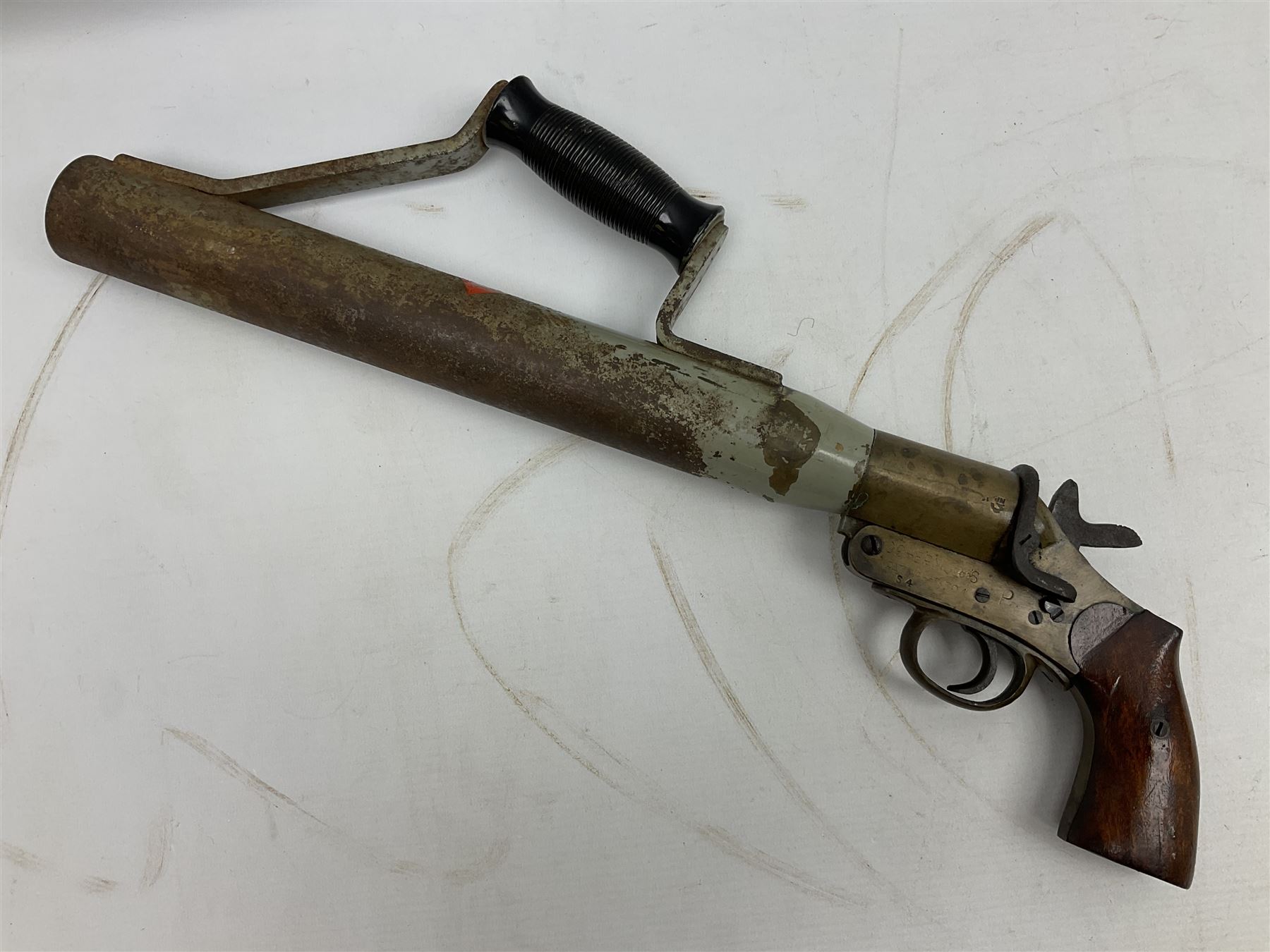 Schermulys Patent No.503324 nitro proof line throwing pistol No.15003; brass body with proof marks; the 32cm steel barrel with secondary handle over and original transfer 'The Schermuly Pistol Rocket Apparatus Ltd. London' L51cm overall