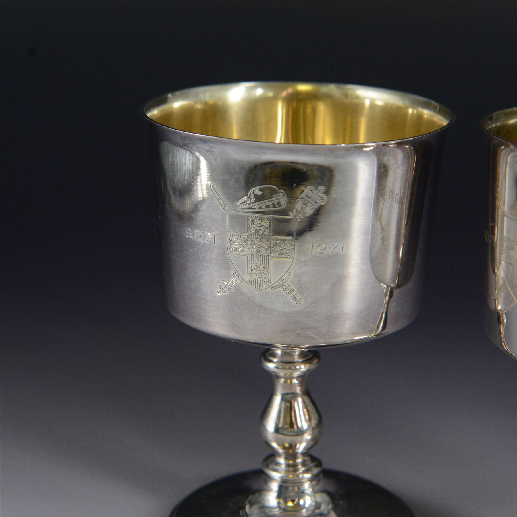 Pair of limited edition silver goblets, commemorating the 1900th  founding of the city of York by, the plain bowl with gilt interior and engraved with York crest dated AD71-1971, upon knopped stem and circular domed foot, hallmarked Barker Ellis Silver Co, Birmingham 1970, H11cm