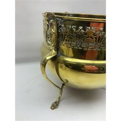 Early 20th century brass coal bucket with pierced sides, upon three pad feet, together with a pair of brass fire dogs, with flambe finials, coal bucket H27cm