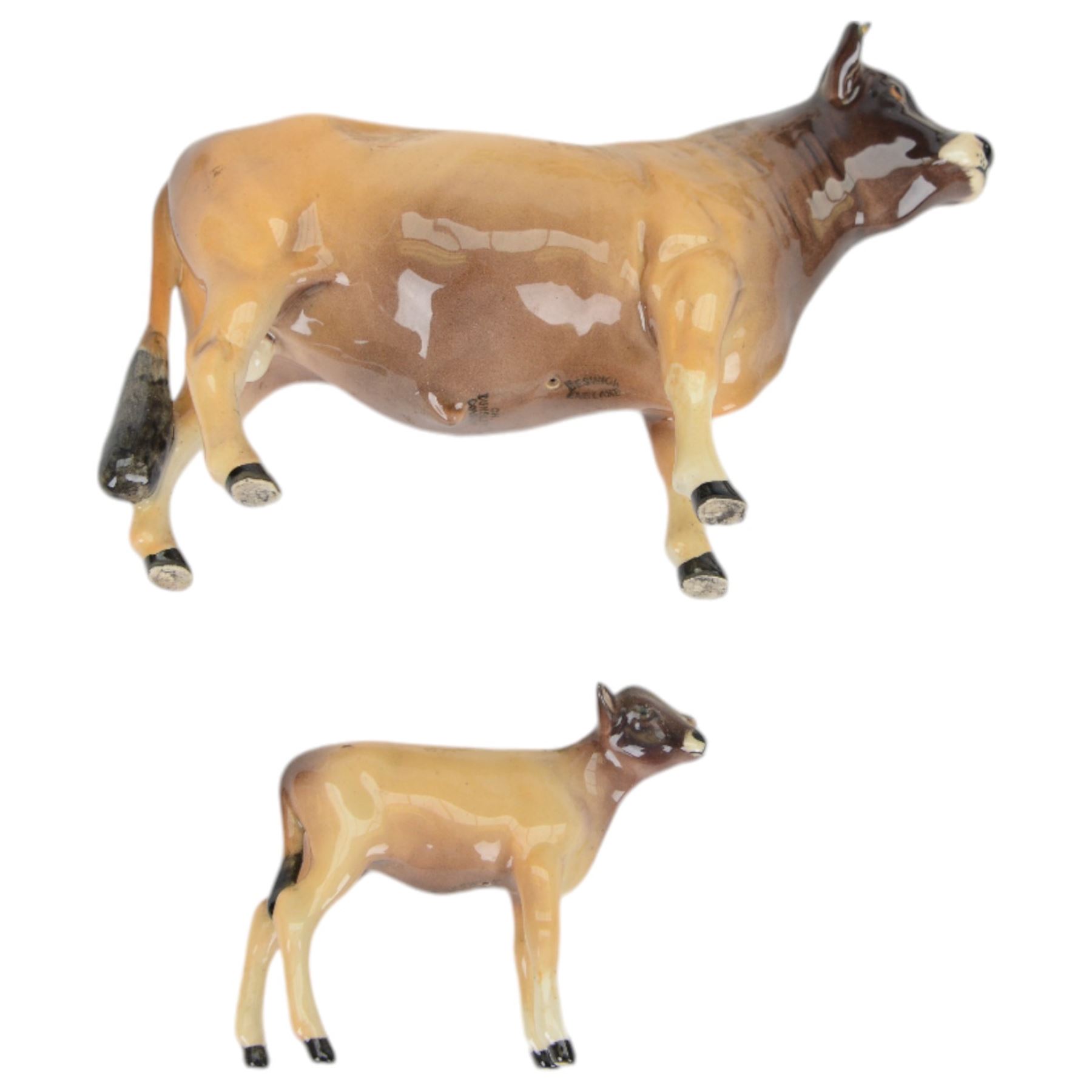 Six Beswick cattle figures, comprising Jersey family group; Bull Ch. Dunsley Coy Boy, model 1422, Cow Ch. Newton Tinkle, model 1345 and Calf, model 1249, Ayrshire family group; Bull Ch. Whitehill Mandate, model 1454, Cow Ch. Ickham Bessie, model 1350, and Calf, model 1249