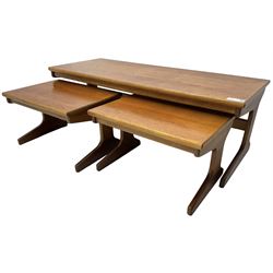 Mid-20th century teak nest of three tables, rectangular coffee table with two side tables, on shaped end supports