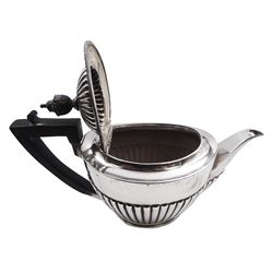 1920's silver teapot and twin handled sucrier, each of part fluted oval form, the teapot with ebonised handle and finial, hallmarked Goldsmiths & Silversmiths Co Ltd, Sheffield 1924, approximate gross weight 20.25 ozt (630 grams)