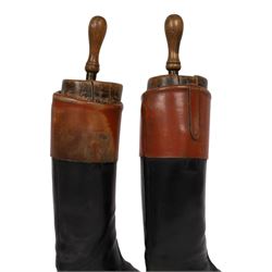 Pair of brown leather topped riding boots, with wooden shoe trees