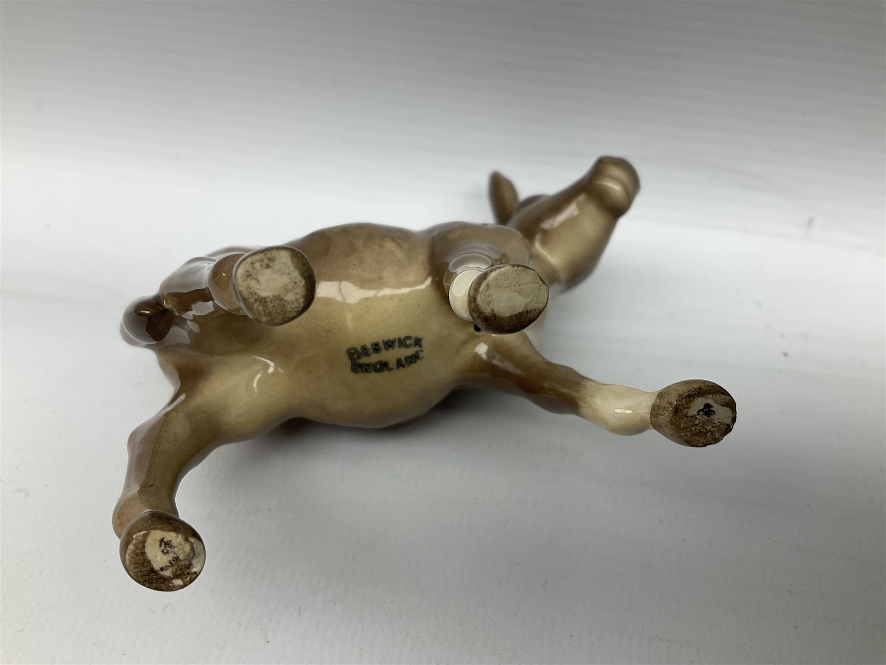 Beswick donkey family to include no.1364b, no.2267a, another donkey and donkey foal (4)