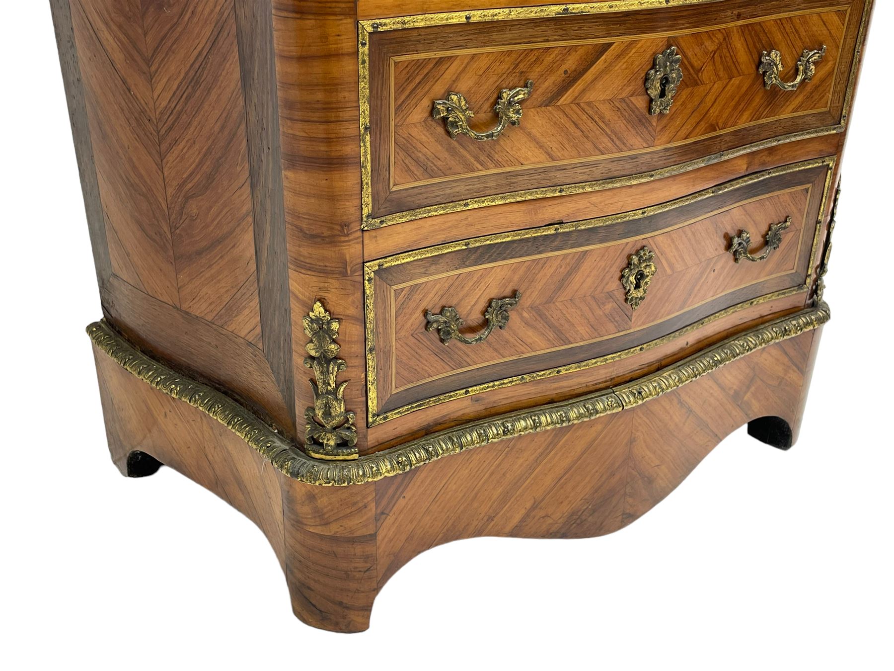 Mid-20th century Louis XVI design Kingwood and walnut secretaire à Abattant, shaped serpentine form with dark rouge variegated marble top, the fall front disguised as three drawers enclosing birdseye maple interior with shelf, drawers and writing surface, four functioning drawers below, decorated with cast gilt metal mouldings and mask cartouches, on skirted base with egg and dart moulded gilt metal edge