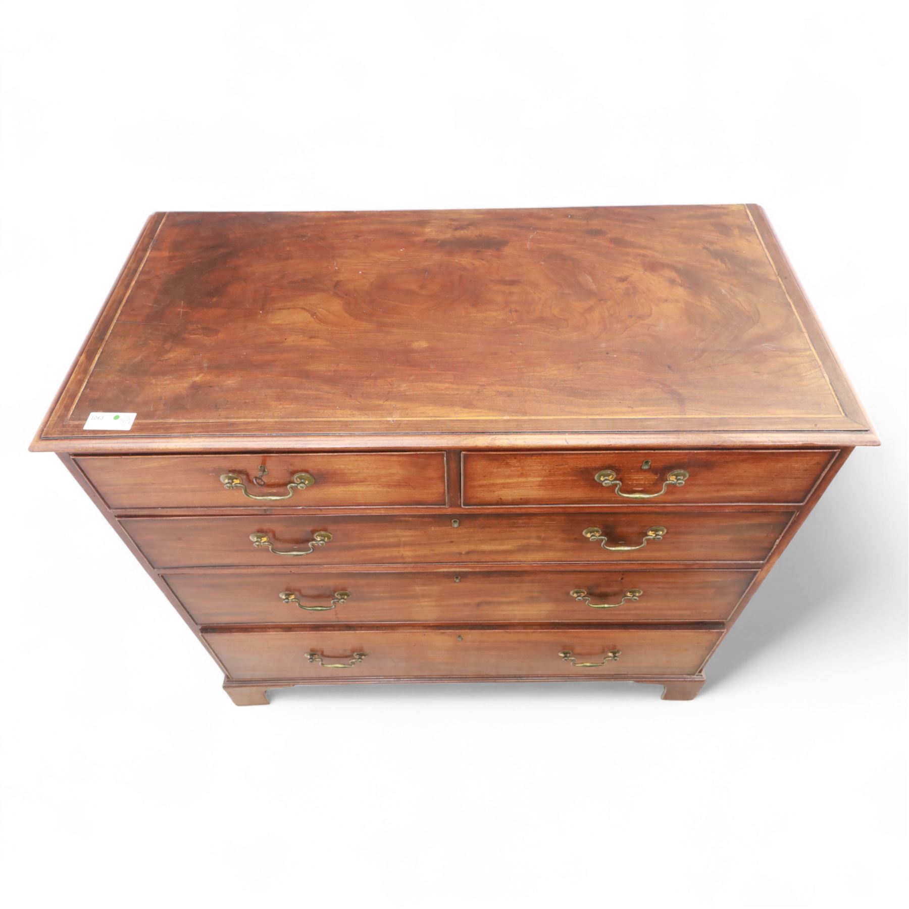 Late 19th-century Georgian-style mahogany chest of drawers, rectangular top with moulded edge over two short and three graduated drawers, raised on bracket feet, back foot missing 